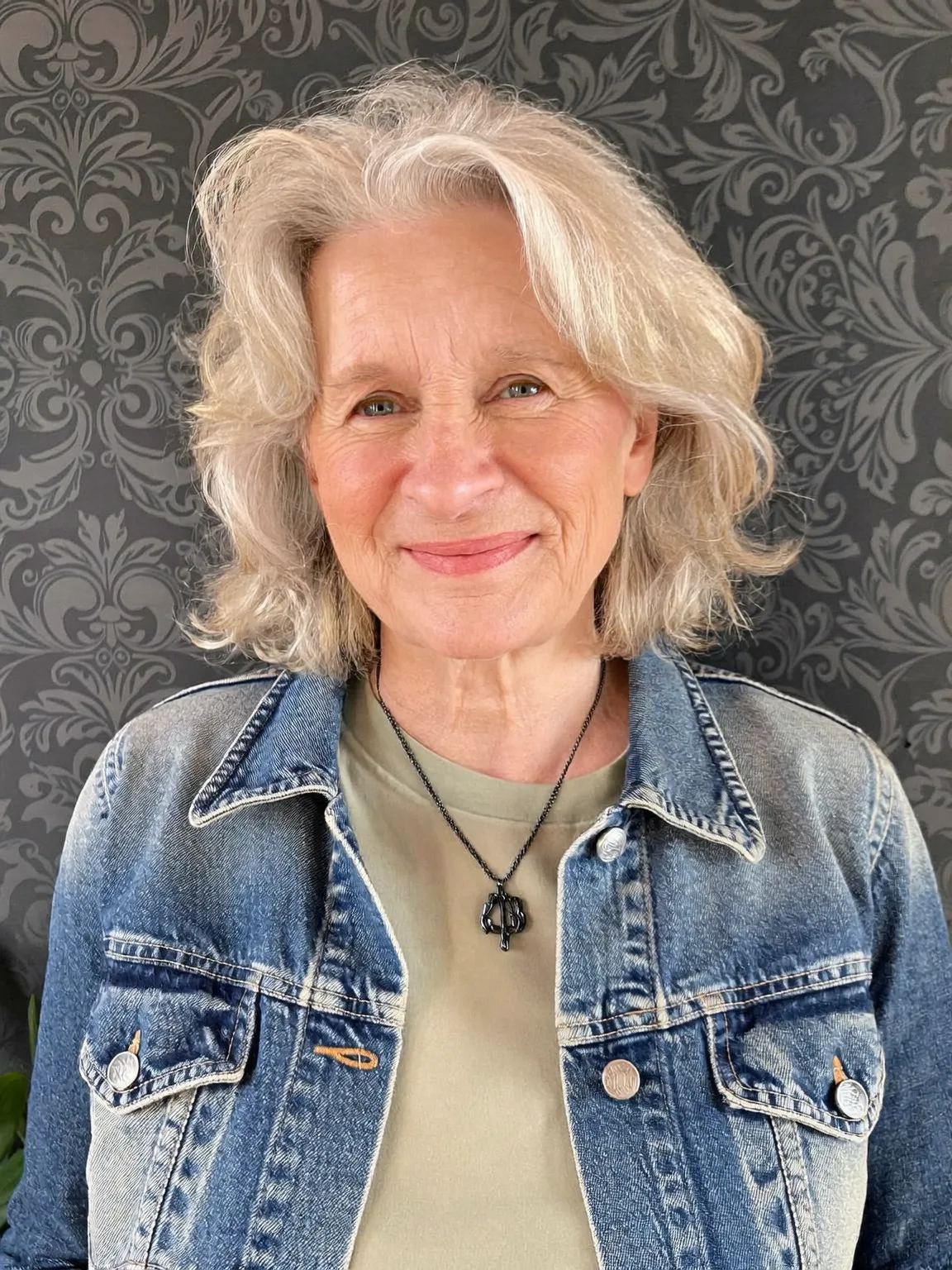 Soft Wavy Layers in Silver Frost with Side-Swept Bangs